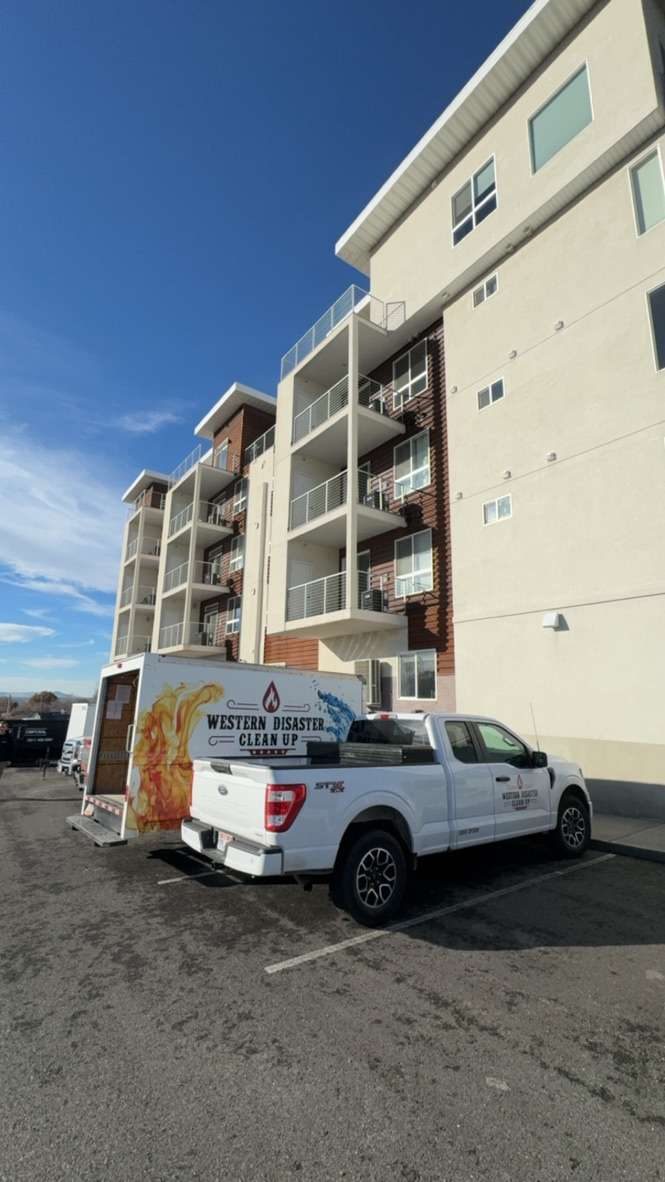 Crew truck staged at a multi family building